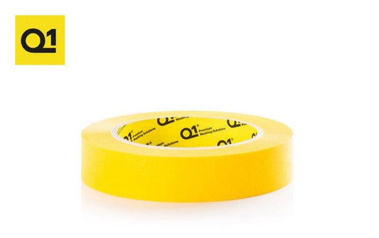Roll of Q1 Premium yellow masking tape on white background with Q1 logo