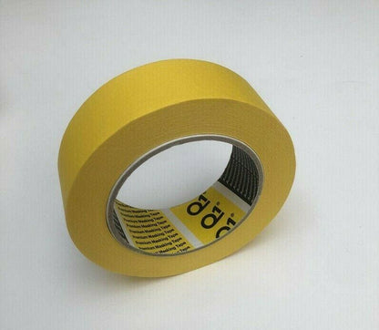 Roll of premium yellow masking tape on white background with text on inner core