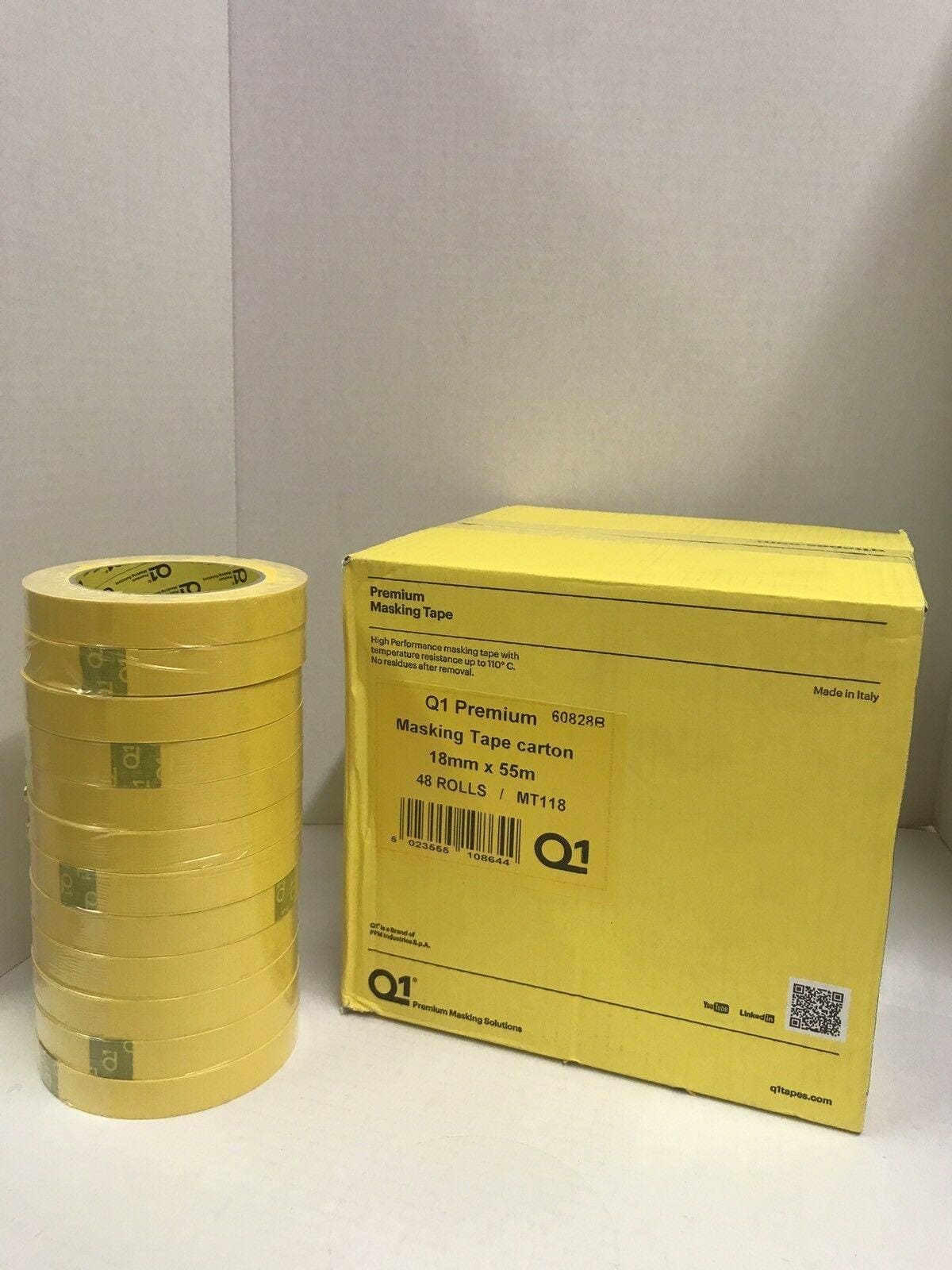 Yellow Q1 Premium masking tape rolls stacked next to a yellow carton box with product details