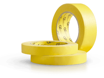 Three rolls of Q1 Premium yellow masking tape stacked and standing on reflective surface
