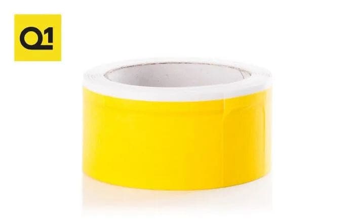 Roll of bright yellow weather stripping tape on white background with Q1 logo